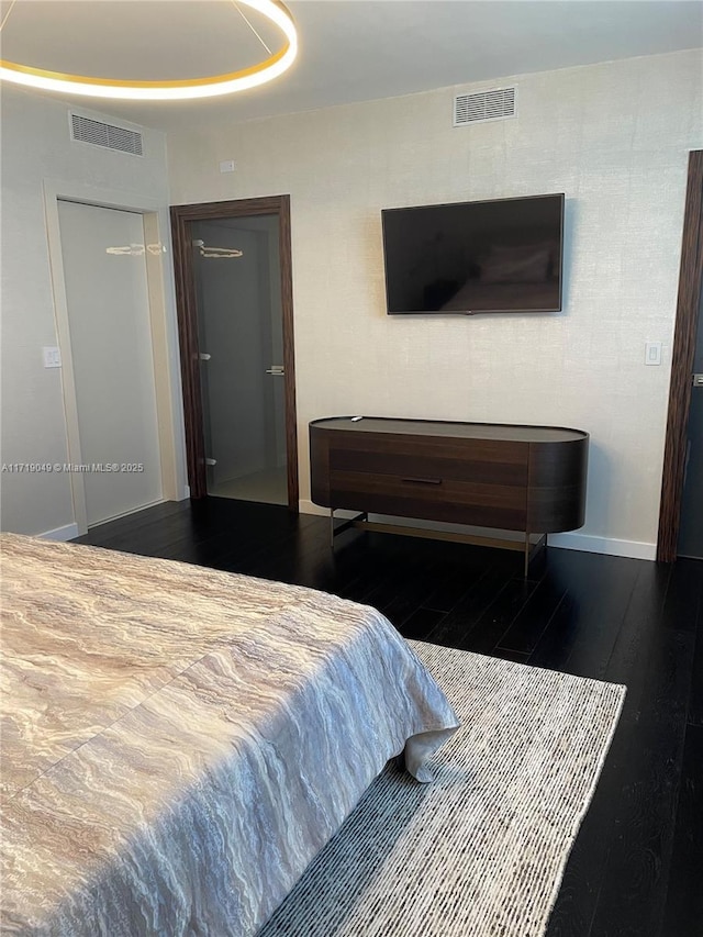 bedroom with dark hardwood / wood-style floors and pool table