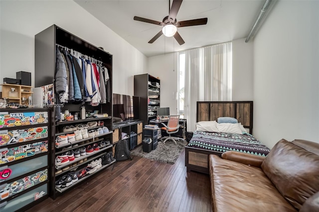 bedroom with hardwood / wood-style flooring and ceiling fan