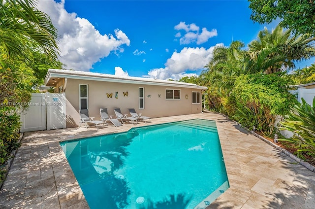 view of swimming pool with a patio area