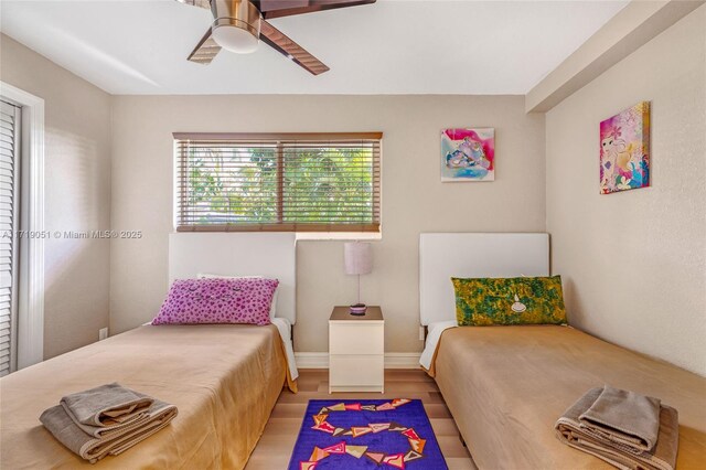 bedroom featuring ceiling fan and light hardwood / wood-style floors