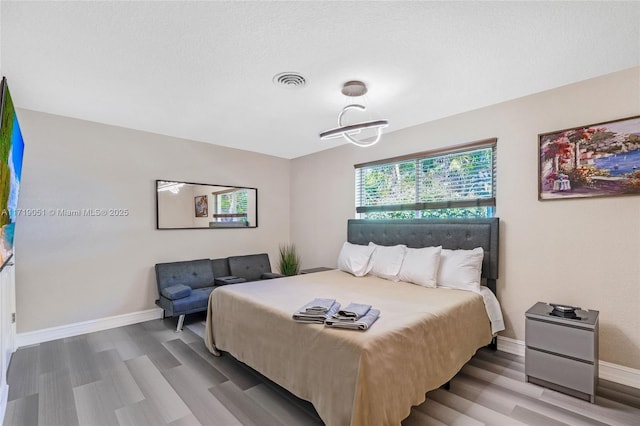 bedroom featuring wood-type flooring