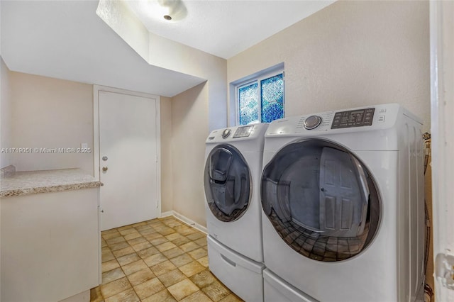 washroom with washing machine and dryer