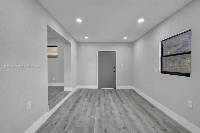 spare room featuring light wood-type flooring