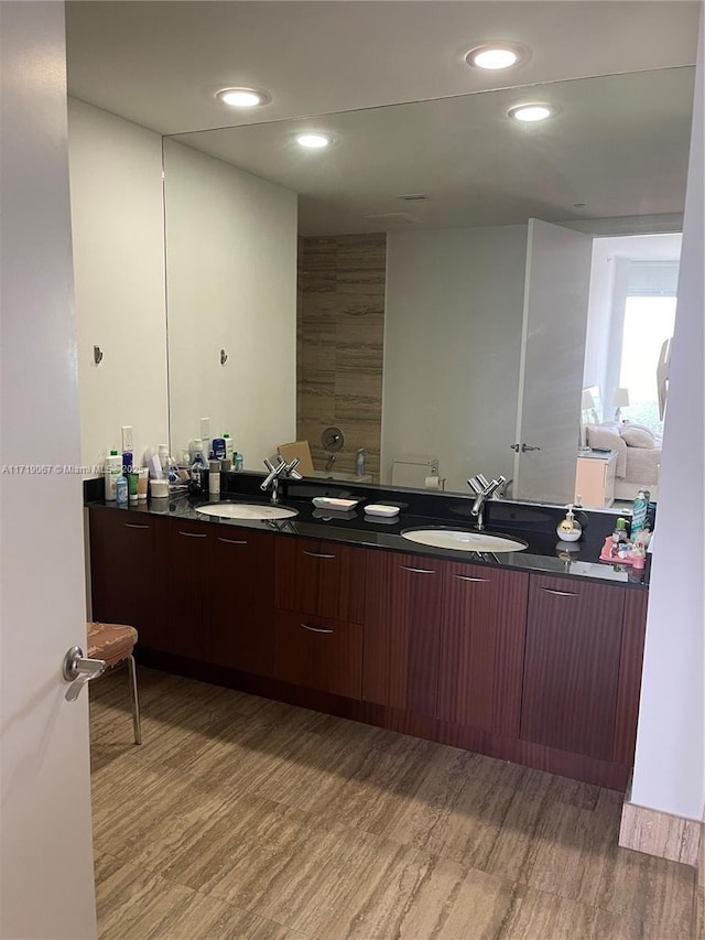 kitchen featuring light wood-type flooring and sink