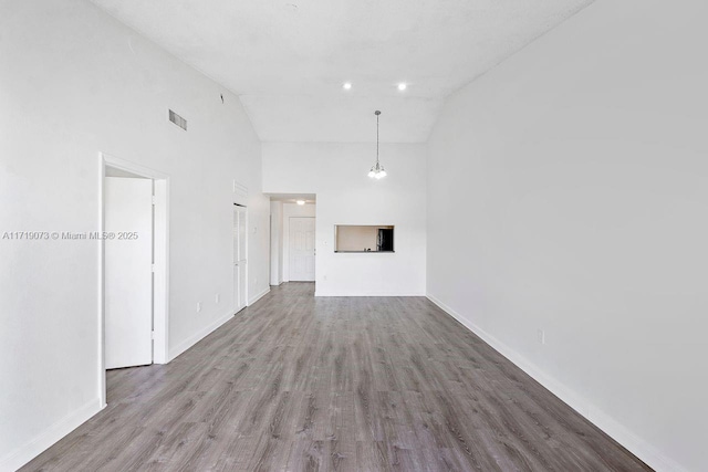 unfurnished living room featuring light hardwood / wood-style flooring and high vaulted ceiling