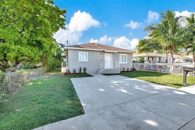 view of front of property with a front lawn