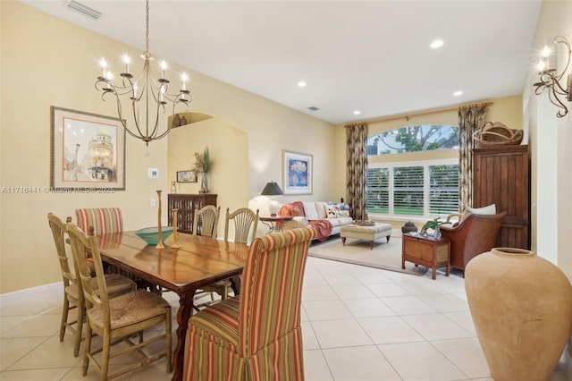 tiled dining area featuring a notable chandelier