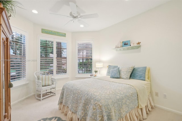 bedroom featuring ceiling fan and light colored carpet