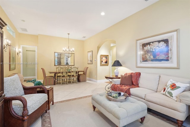 living room featuring a chandelier and light tile patterned floors