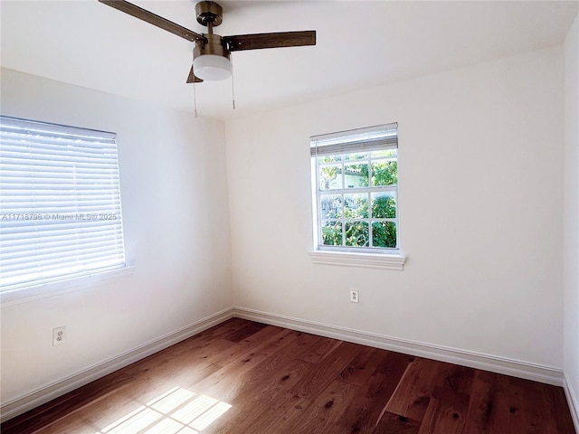 empty room featuring hardwood / wood-style floors and ceiling fan