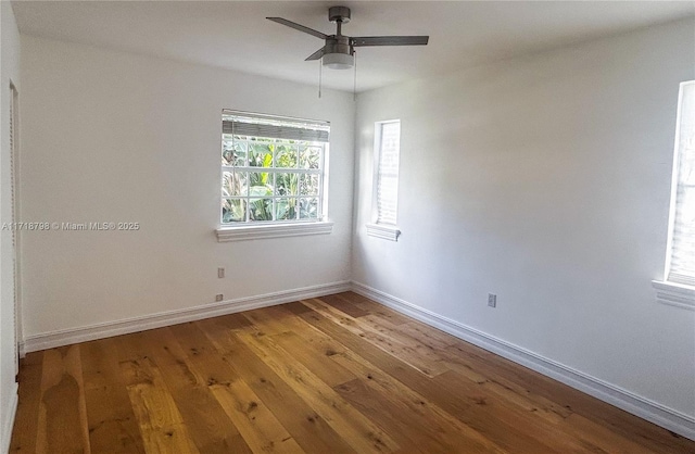 unfurnished room with hardwood / wood-style floors and ceiling fan