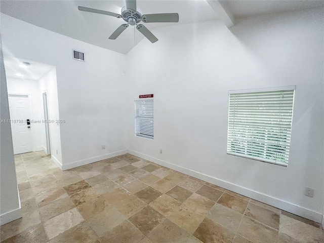 spare room with ceiling fan and vaulted ceiling