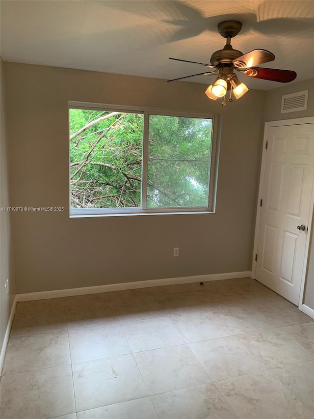 2250 W 5th Way, Hialeah, FL 33010 - unfurnished room with baseboards and a ceiling fan