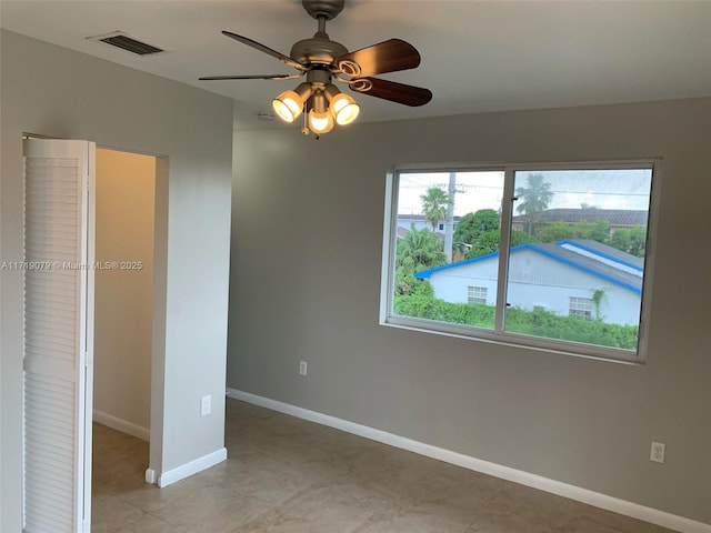 unfurnished room featuring ceiling fan