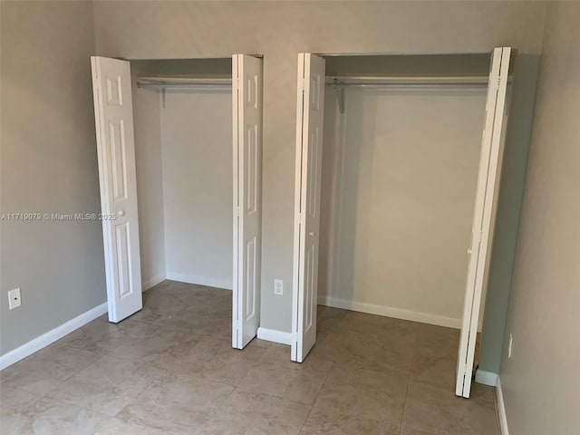 2250 W 5th Way, Hialeah, FL 33010 - unfurnished bedroom featuring light tile patterned floors and baseboards