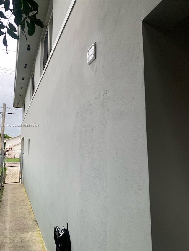 2250 W 5th Way, Hialeah, FL 33010 - view of home's exterior featuring a gate and stucco siding
