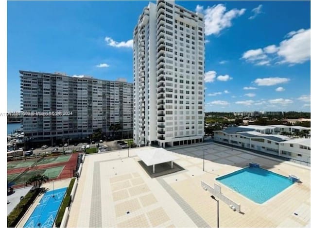 view of swimming pool with a patio area