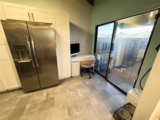 kitchen with stainless steel fridge with ice dispenser and white cabinets