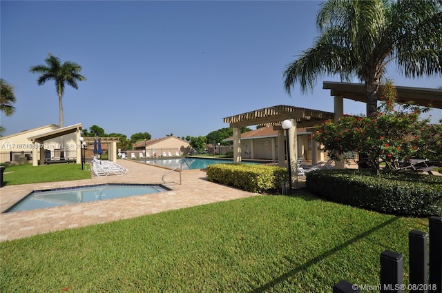 view of swimming pool featuring a patio area, a yard, and a pergola