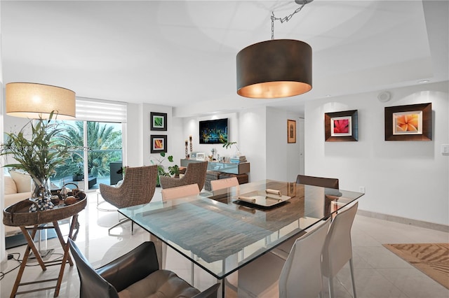 dining area featuring light tile patterned floors