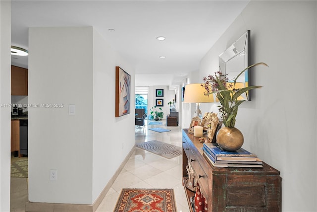 hall featuring light tile patterned flooring