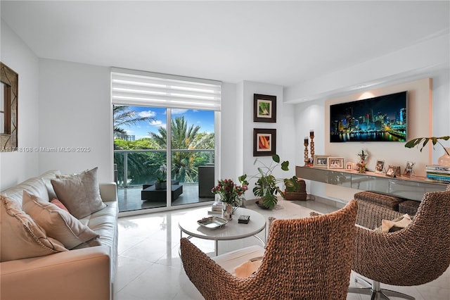 living room with light tile patterned floors and a wall of windows