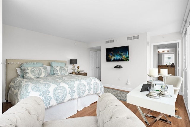 bedroom with hardwood / wood-style flooring