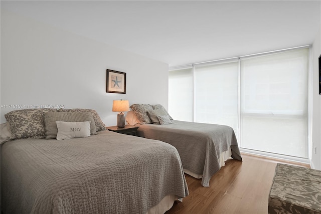 bedroom with hardwood / wood-style floors