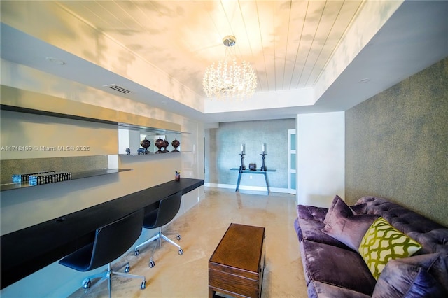 interior space with a notable chandelier, built in desk, wood ceiling, and a tray ceiling