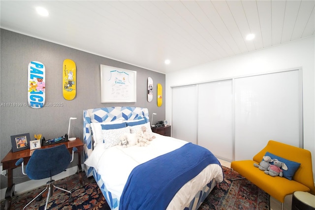 bedroom with a closet and wood ceiling