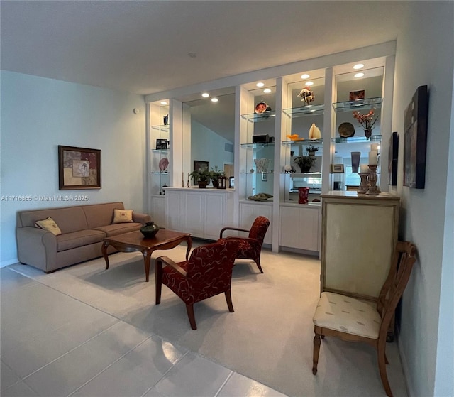 tiled living room featuring built in shelves