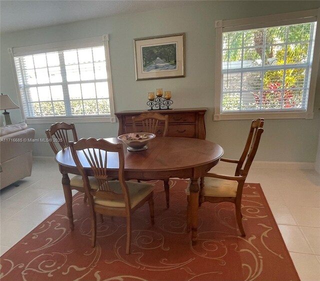 dining space featuring tile patterned flooring