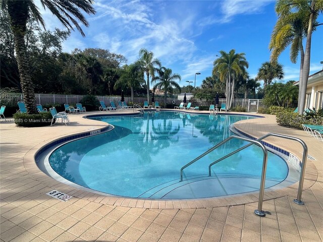 view of swimming pool with a patio area