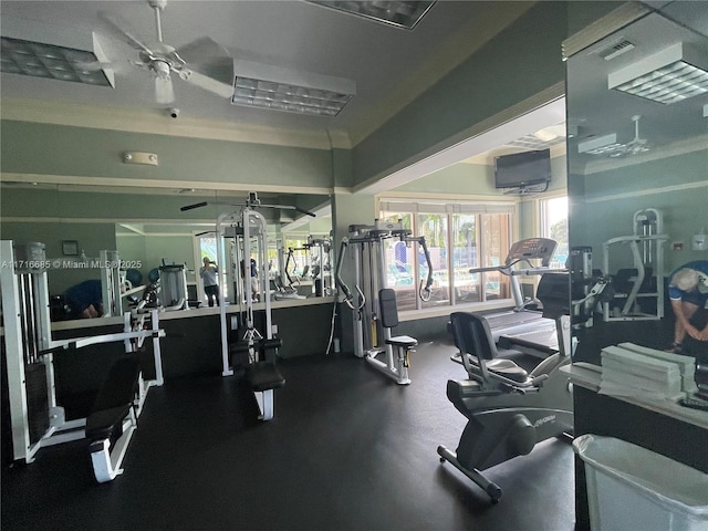 exercise room with ceiling fan