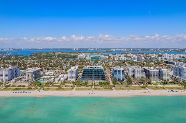 aerial view featuring a view of the beach and a water view