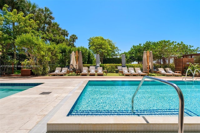 view of swimming pool with a patio area