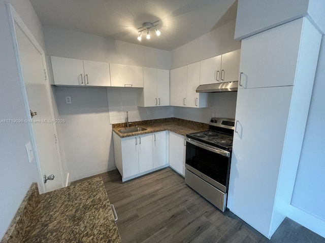 kitchen featuring stainless steel range, dark hardwood / wood-style floors, white cabinetry, and sink