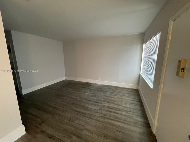 empty room featuring dark hardwood / wood-style floors