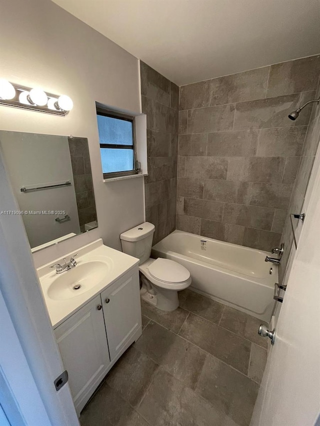 full bathroom featuring vanity, toilet, and tiled shower / bath combo