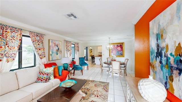 living room with light tile patterned flooring, crown molding, and a notable chandelier