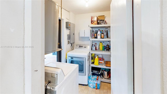 washroom with electric panel and independent washer and dryer