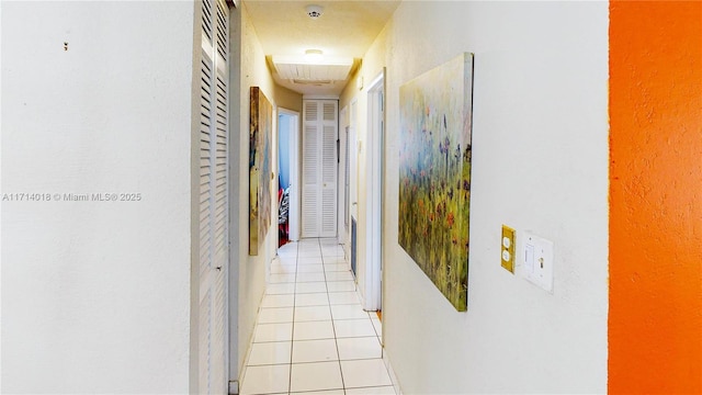 hallway with light tile patterned floors