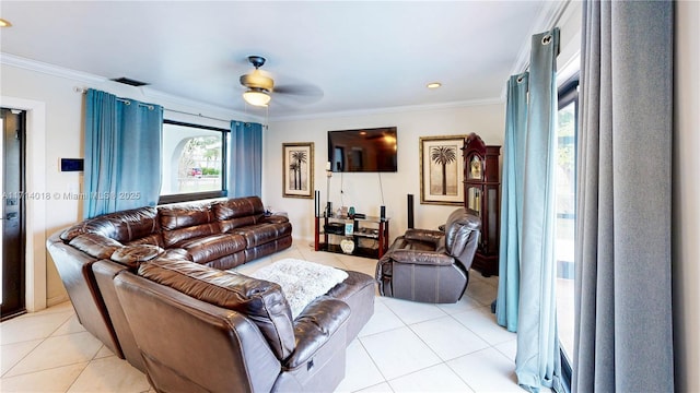 living room with ceiling fan, light tile patterned floors, and ornamental molding