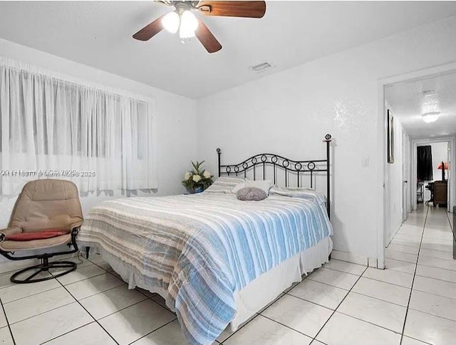 bedroom featuring ceiling fan and light tile patterned flooring