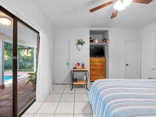 tiled bedroom with access to exterior and ceiling fan