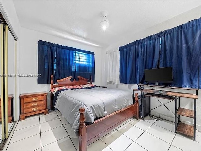 bedroom with tile patterned floors