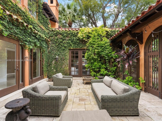 view of patio with outdoor lounge area and french doors