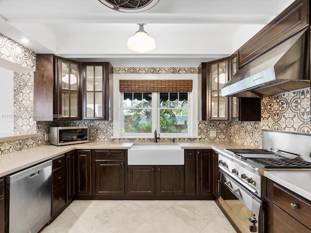 kitchen with tasteful backsplash, extractor fan, stainless steel appliances, and sink