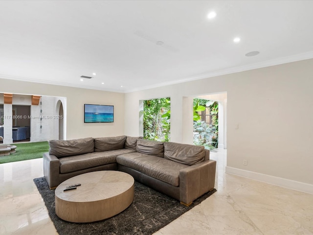 living room with ornamental molding