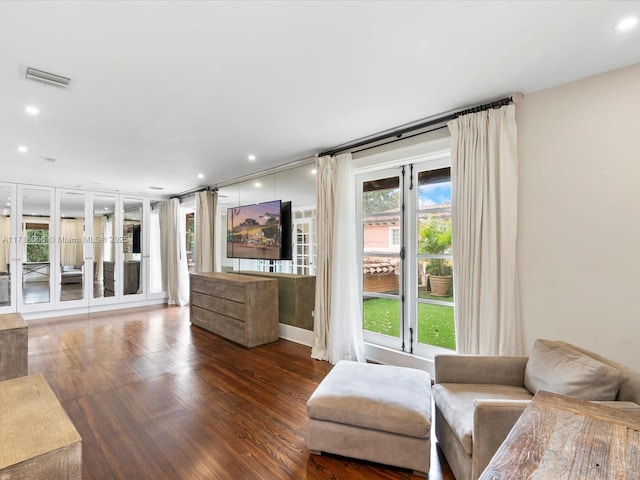 unfurnished living room with dark wood-type flooring